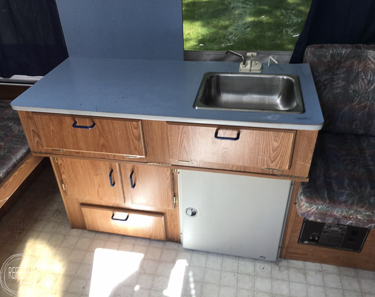 cabinets in old pop up camper before painting