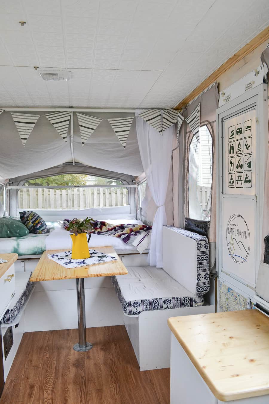 https://refreshcamping.com/wp-content/uploads/2017/11/remodeled-pop-up-camper-rv-with-vintage-boho-electic-design-new-ceiling-counters-painted-cabinets-table-and-backsplash-8-of-10.jpg