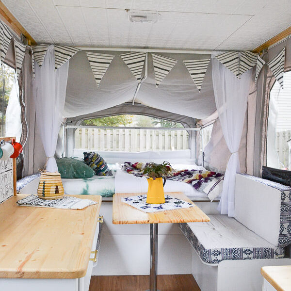I want to camp in this! A 1990s pop-up camper gets a complete remodel, including a new roof to replace the leaky one. Pop up camper remodel with an eclectic vintage boho feel via Refresh Living.