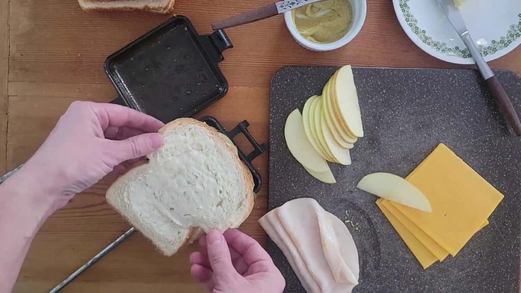assemble sandwich in pie iron