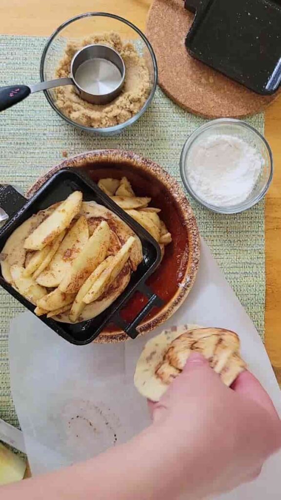 camping apple pie in a pie iron with campfire cinnamon rolls