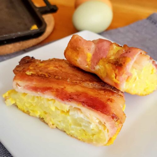https://refreshcamping.com/wp-content/uploads/2023/05/camping-breakfast-pie-iron-recipe-with-eggs-hashbrowns-and-bacon-500x500.jpg