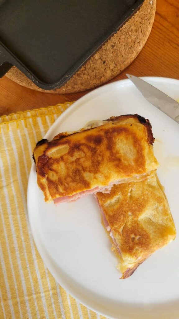 ham and swiss camping sandwich maker recipe with cheese and ham cooked in a pie iron