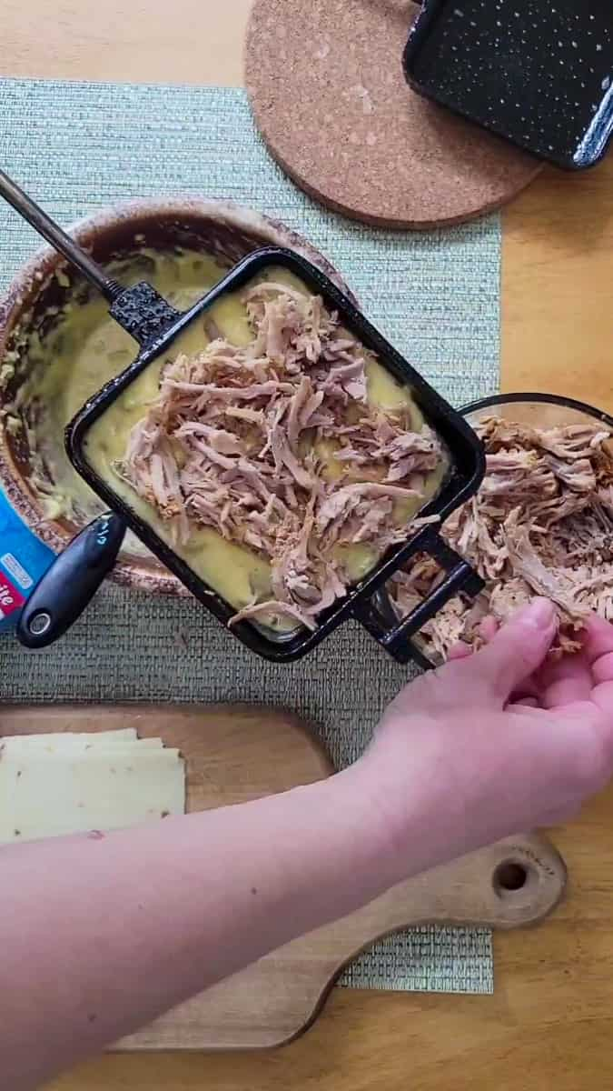 https://refreshcamping.com/wp-content/uploads/2023/05/pulled-pork-cornbread-campfire-pie-iron-recipe-3.jpg