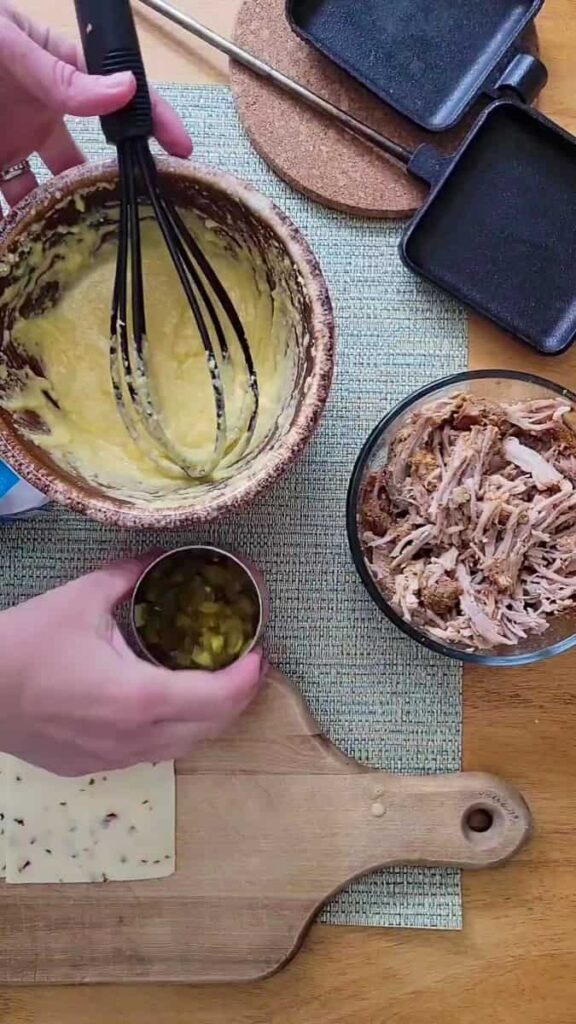 mix cornbread with green chilis and pulled pork to make a hobo pie recipe