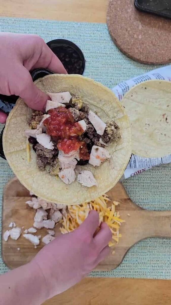 make tacos in a pie iron with corn tortillas and filling