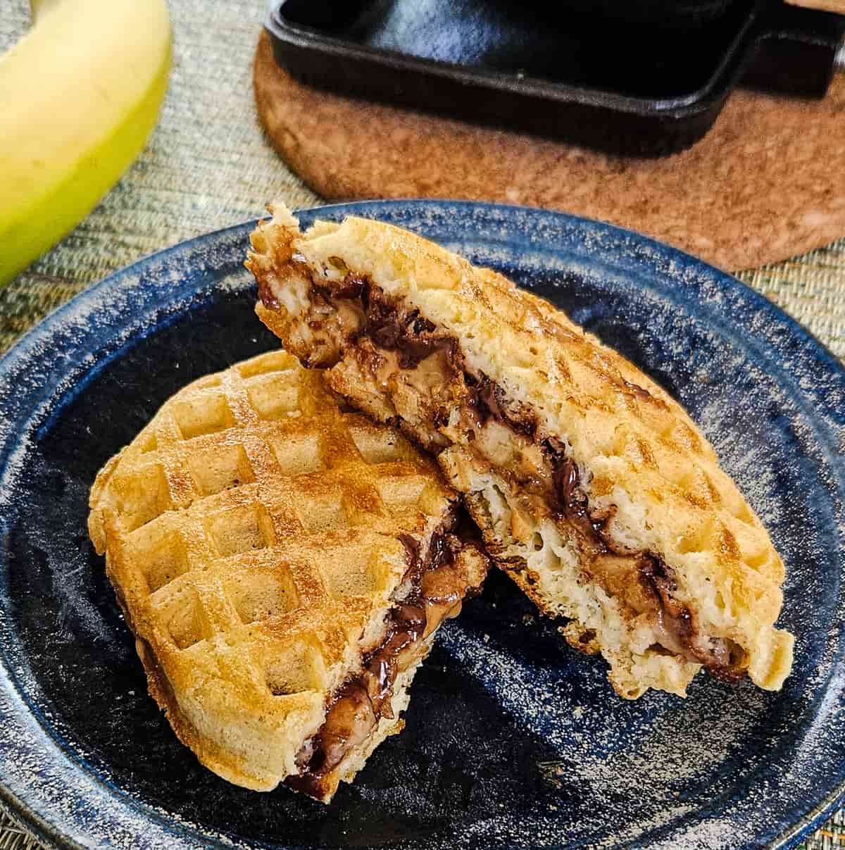 camping waffles with peanut butter and bananas cooked in a pie iron