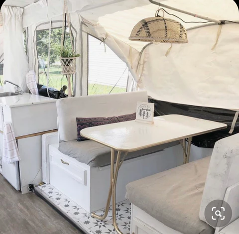 neutral pop up camper makeover with white cabinets and white countertops