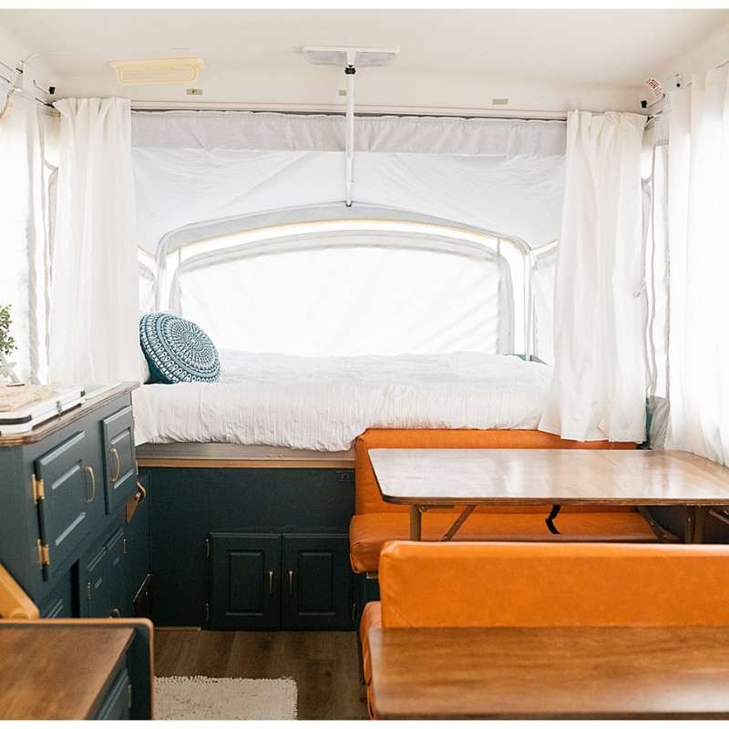 navy cabinets tan leather seating in camper