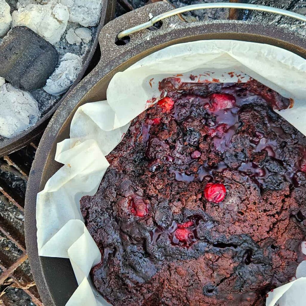 camping dessert with chocolate cake and cherries in this dutch oven dump cake recipe