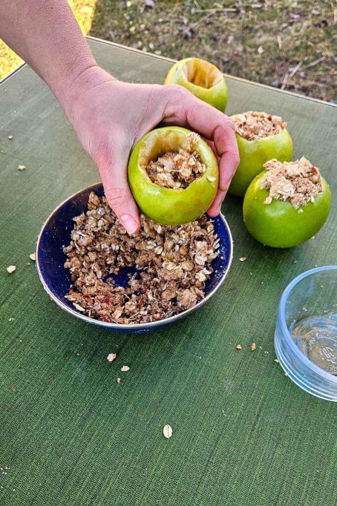 campfire baked apples recipe stuffed with filling for camping dessert