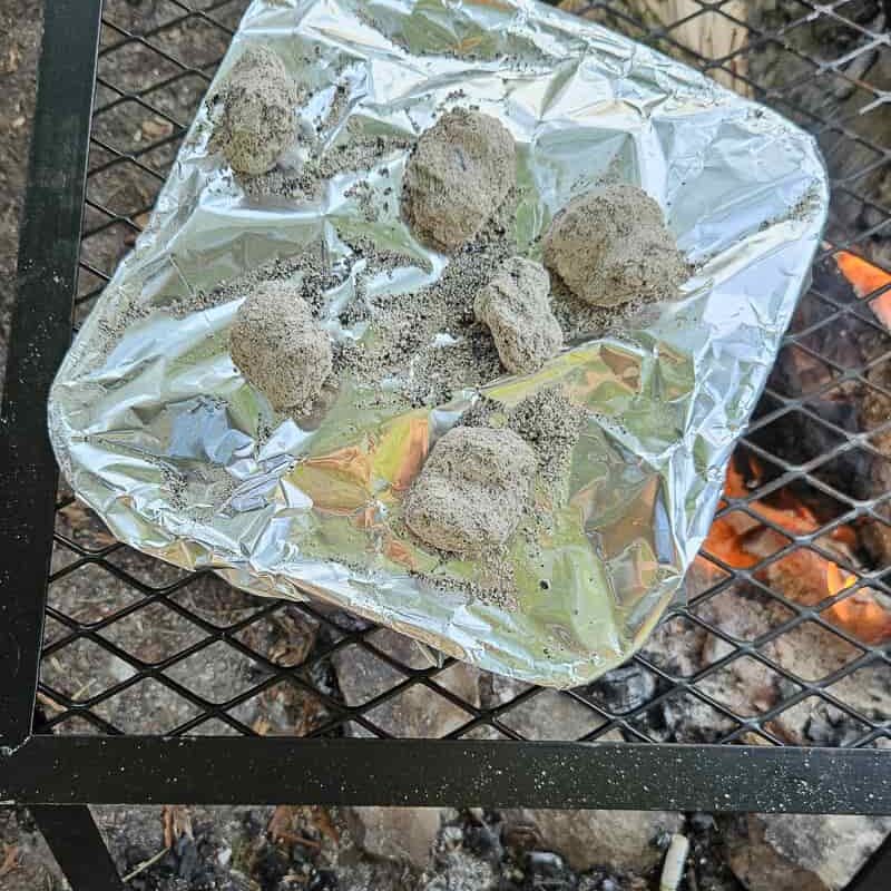 use aluminum pan to cook campfire nachos over fire