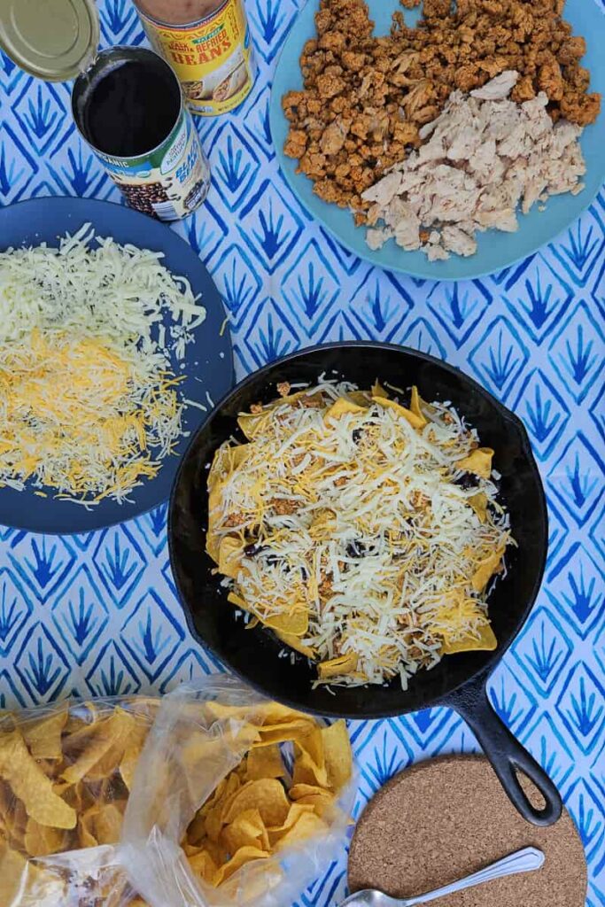 camping nachos recipe over the campfire in cast iron skillet or dutch oven
