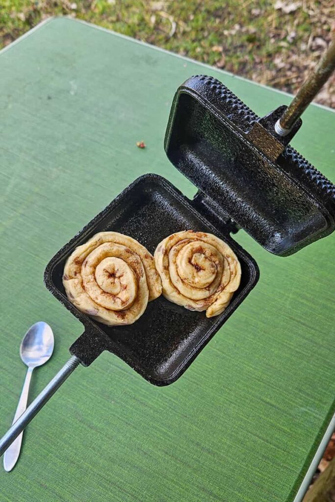 A great way to make cinnamon rolls while camping - in a pie iron!