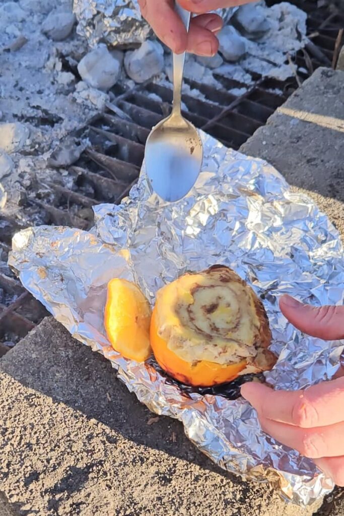 how to make cinnamon rolls while camping 4 different ways including in an orange pee;l