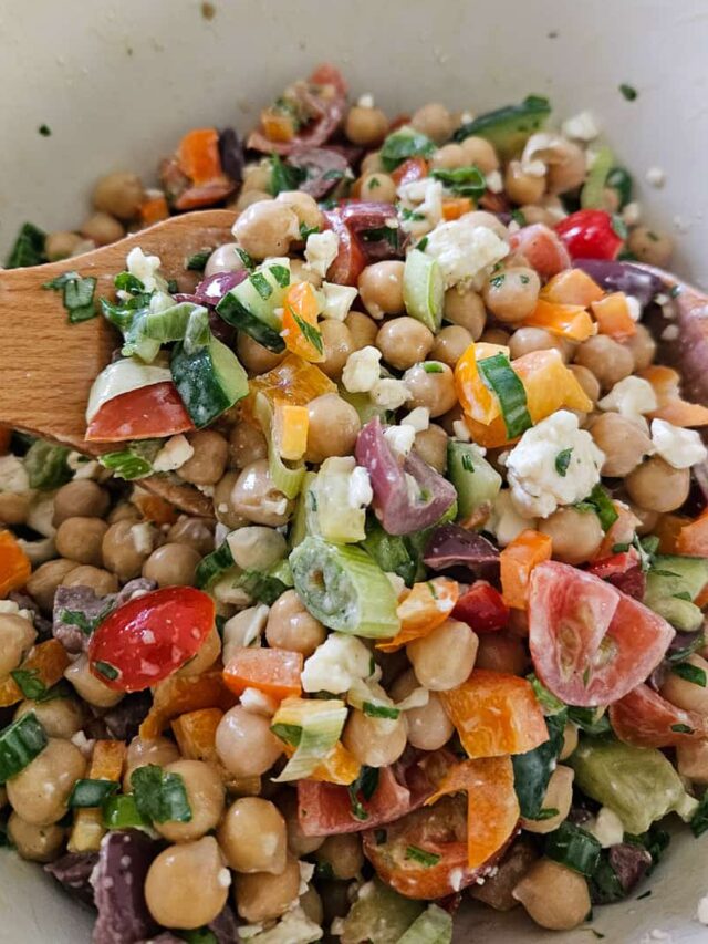 garbanzo bean salad with pepper, cucumber, tomato, feta, parsley and lemon garlic dressing