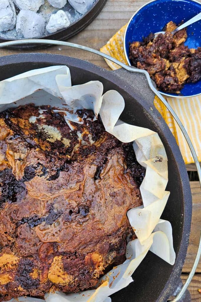 dutch oven brownie recipe with peanut butter cooked over the campfire with dump cake brownie recipe