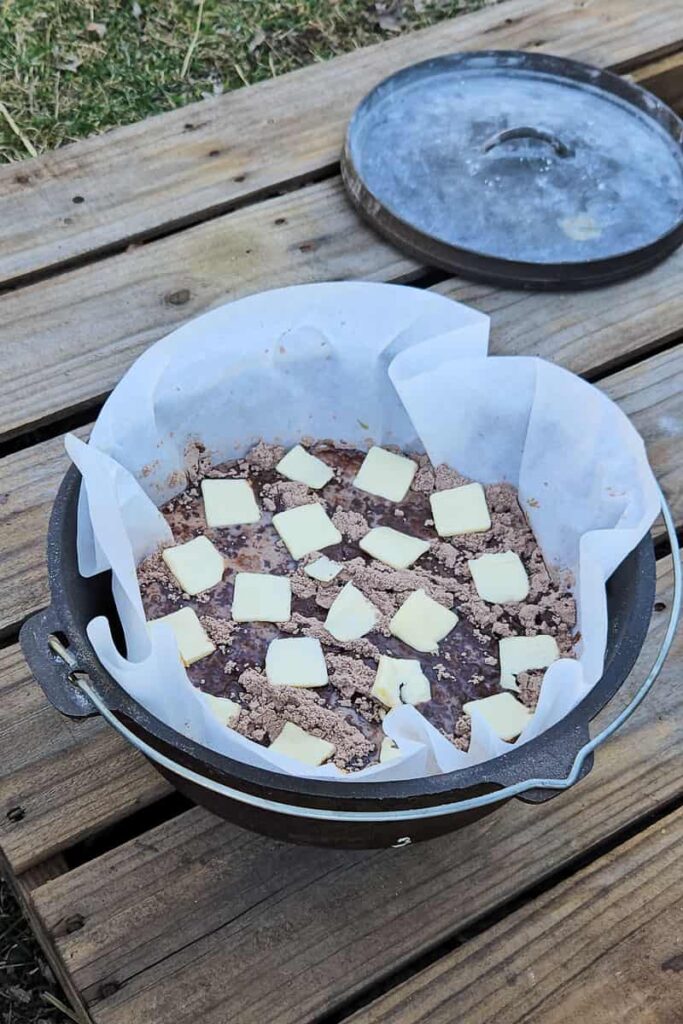 dump cake brownies cooked over the campfire in a dutch oven