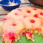 dutch oven pineapple upside down dump cake cooked over the campfire for the best camping dessert