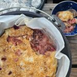 dutch oven cake with strawberries and cream cheese