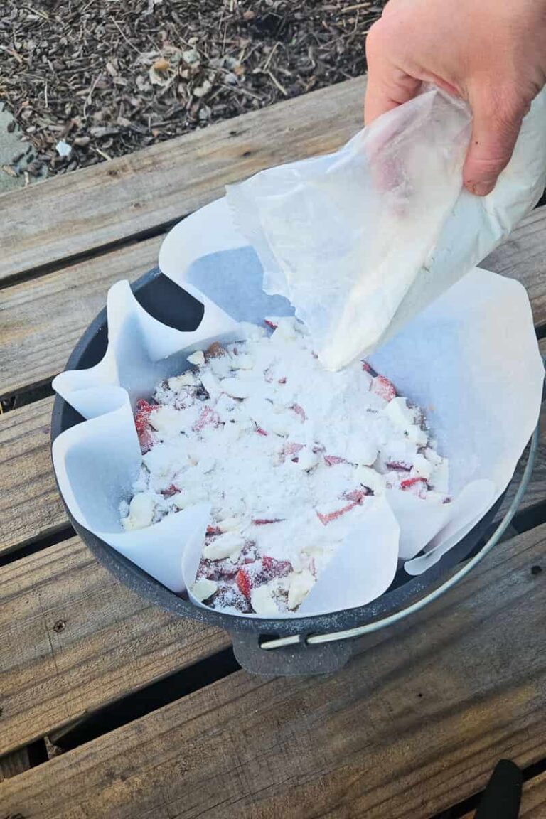 Dutch Oven Strawberry Cheesecake Dump Cake - Refresh Camping