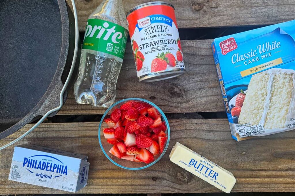 ingredients in dutch oven dump cake for strawberry cheesecake camping dessert