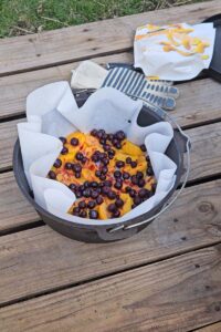 Peach Blueberry Dutch Oven Cake - Refresh Camping