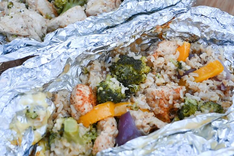 chicken foil packet dinner for camping with broccoli, rice, onion and peppers