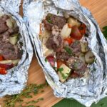 camping foil packet dinner with steak, potatoes and peppers