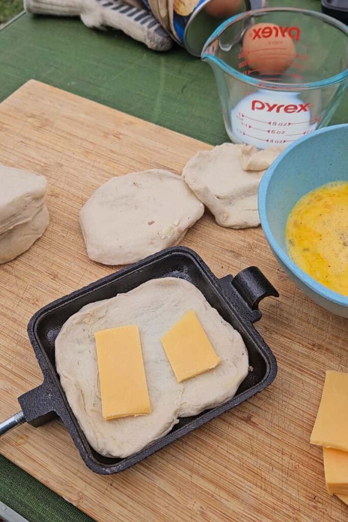 cheddar cheese on biscuit for pie iron sausage egg biscuit camping recipe