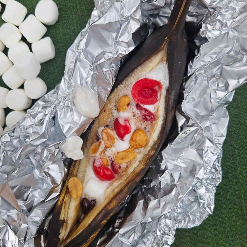 banana split banana boats with cherries, chocolate and peanuts