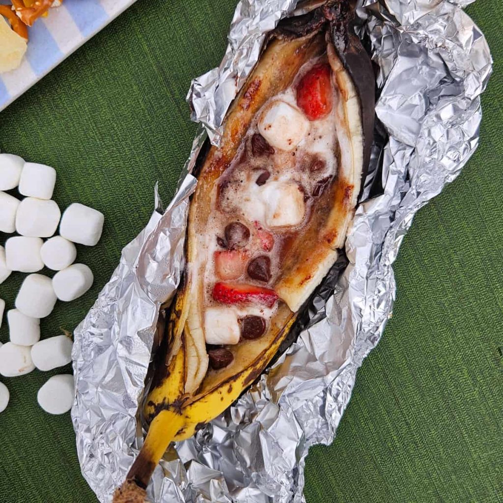 banana boat filled with chocolate strawberries and marshmallows