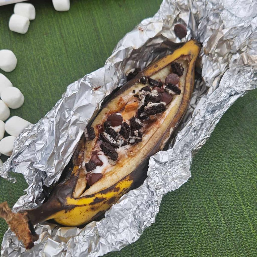 banana boats on campfire with oreos, peanut butter and marshmallows