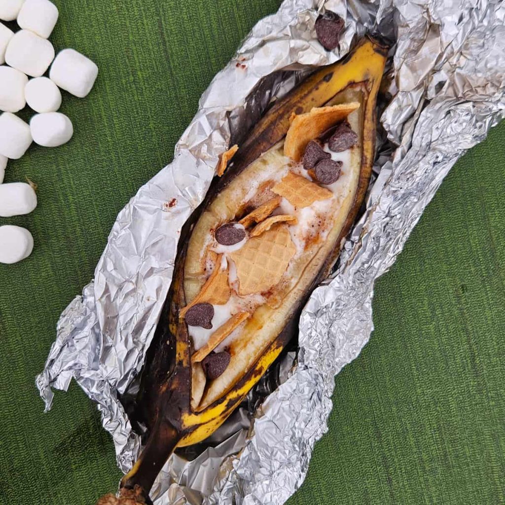 smores banana boat with chocolate, marshmallows and graham crackers