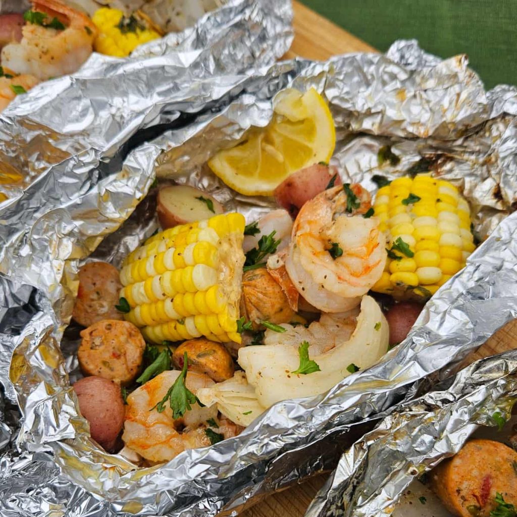 shrimp foil packets with corn, potatoes, shrimp, sausage and onion