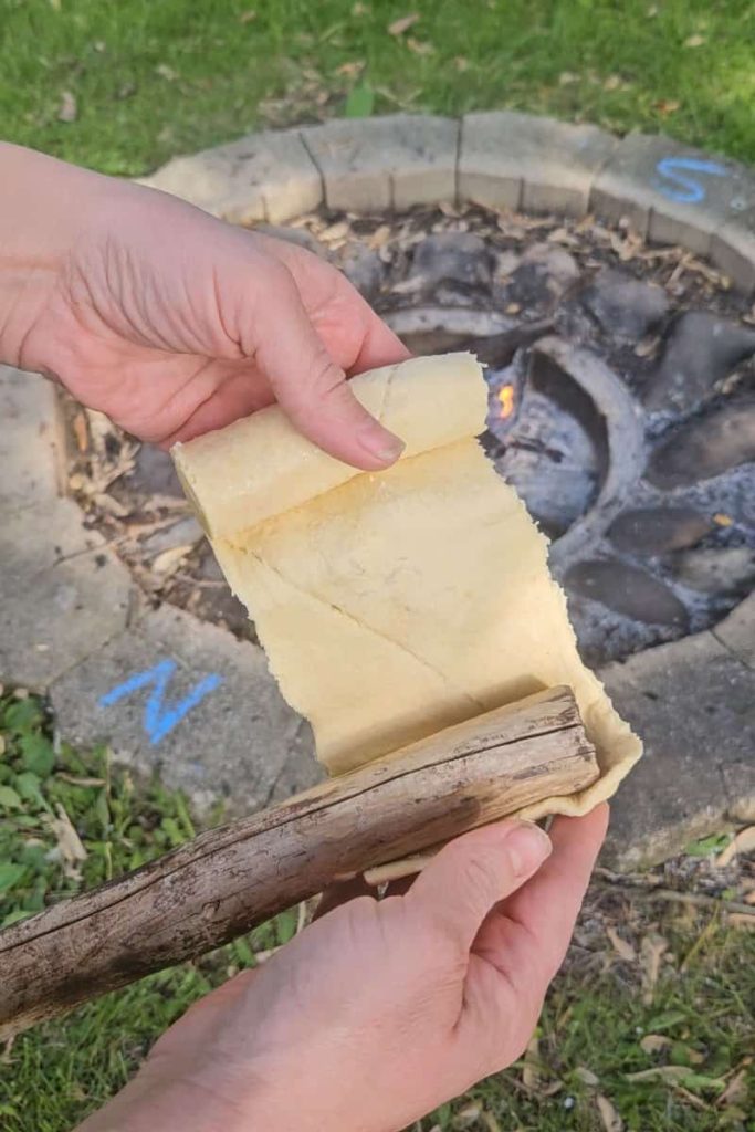 wrap crescent dough around a stick to make campfire eclairs