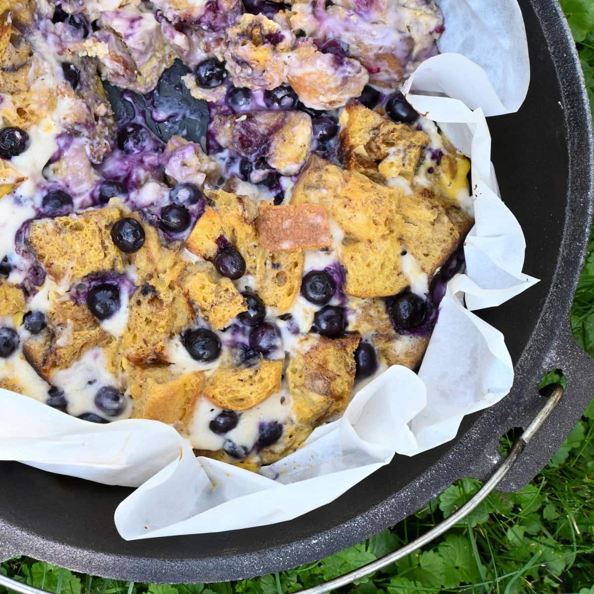 camping breakfast recipe in dutch oven french toast with blueberries and cream cheese