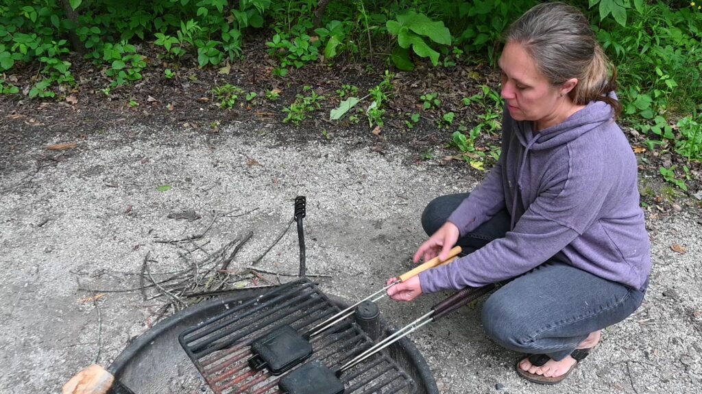 cooking with a pie iron while camping